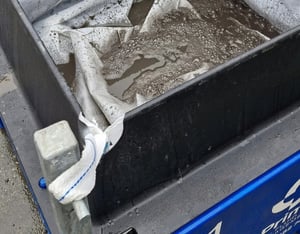Filter bag inside an EnviroHub CW-01 capturing solids from concrete washdown water