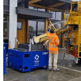 Prime concrete washout unit receiving wash water from a concrete truck
