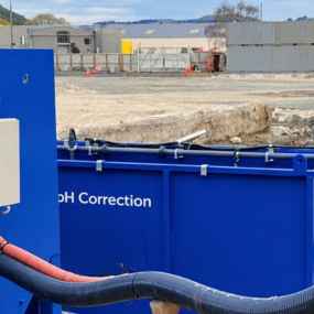 Prime pH correction system treating water on a construction site